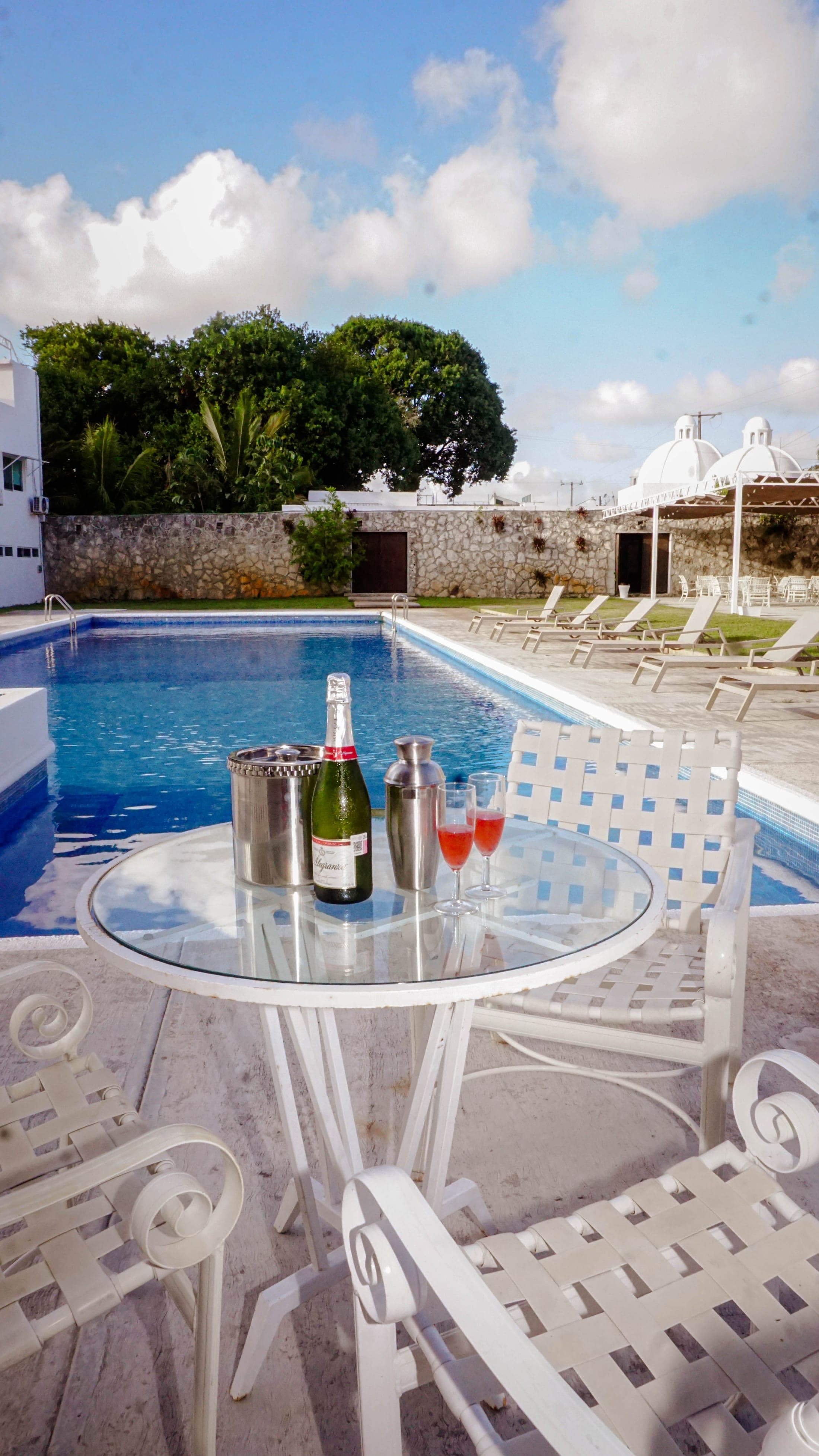 A toast by the pool at sunset
